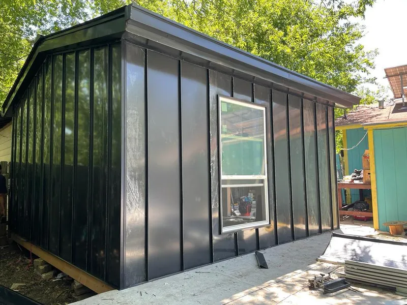 Black standing seam metal wall panels for Metal Roof Installation in Caledonia